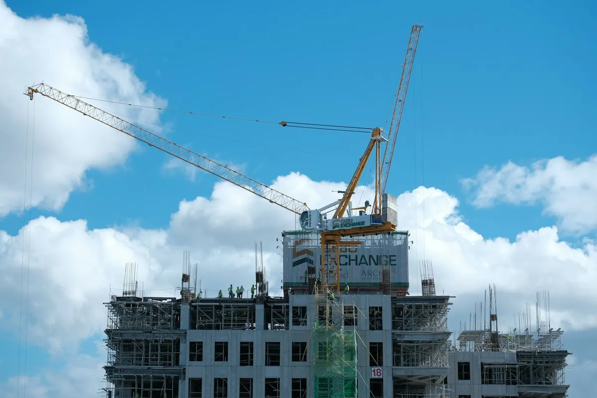 Tower cranes above a building under construction